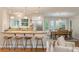 Bright kitchen featuring a breakfast bar with seating, stainless steel appliances, and an adjacent dining area at 5114 N Ivy Ne Rd, Atlanta, GA 30342