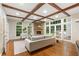 Inviting living room with fireplace, coffered ceilings, hardwood floors, and large windows at 5114 N Ivy Ne Rd, Atlanta, GA 30342