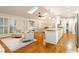 Open living area with skylights, bar seating area, and a view to the sitting area at 5114 N Ivy Ne Rd, Atlanta, GA 30342