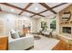 Bright and spacious living room with hardwood floors, a fireplace, and a view to the kitchen at 5114 N Ivy Ne Rd, Atlanta, GA 30342