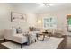 Inviting living room with large windows, modern furniture, and stylish decor at 5114 N Ivy Ne Rd, Atlanta, GA 30342