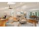 Bright open-concept living area with hardwood floors, skylights, dining areas and seamless flow for entertaining at 5114 N Ivy Ne Rd, Atlanta, GA 30342