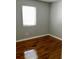 Bright bedroom with hardwood floors, neutral walls, and a window offering natural light at 561 Formwalt Sw St # 7, Atlanta, GA 30312