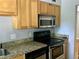 Kitchen with granite countertops, stainless appliances, and a gas cooktop at 561 Formwalt Sw St # 7, Atlanta, GA 30312