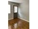 Neutral living room featuring natural light, wood-look flooring, and fresh gray paint at 561 Formwalt Sw St # 7, Atlanta, GA 30312