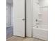 Bathroom featuring tub and white cabinets at 1539 High Falls Ln, Grayson, GA 30017