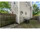 Home exterior featuring a fenced yard, AC unit, and satellite dish at 1902 Memorial Se Dr, Atlanta, GA 30317
