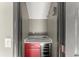 Cozy bar area features a red cabinet and a built-in wine cooler for entertaining at 1902 Memorial Se Dr, Atlanta, GA 30317