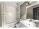 Bright bathroom featuring a marble-tiled shower and modern vanity at 1902 Memorial Se Dr, Atlanta, GA 30317