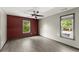 Bright bedroom with hardwood floors, ceiling fan, and plenty of natural light at 1902 Memorial Se Dr, Atlanta, GA 30317