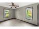 Bright bedroom features wood-look floors and a modern ceiling fan at 1902 Memorial Se Dr, Atlanta, GA 30317