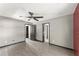 Spacious bedroom features hardwood floors, ceiling fan, and dual closets at 1902 Memorial Se Dr, Atlanta, GA 30317