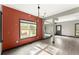Bright dining room with hardwood floors and a modern chandelier, and ample natural light at 1902 Memorial Se Dr, Atlanta, GA 30317