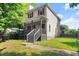 Charming two-story home featuring a covered front porch and well-maintained yard at 1902 Memorial Se Dr, Atlanta, GA 30317