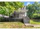 Exterior shot with a view of the gray home's front porch at 1902 Memorial Se Dr, Atlanta, GA 30317