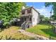 Charming home with gray siding, red accents, and a covered front porch at 1902 Memorial Se Dr, Atlanta, GA 30317