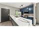 Modern kitchen featuring a large island with waterfall countertops and stainless-steel appliances at 1902 Memorial Se Dr, Atlanta, GA 30317