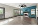 Bright living room with a fireplace, hardwood floors, and windows overlooking the backyard at 1902 Memorial Se Dr, Atlanta, GA 30317
