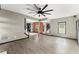 Spacious living room featuring hardwood floors, a modern ceiling fan, and an open floor plan at 1902 Memorial Se Dr, Atlanta, GA 30317