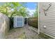 Backyard with a storage shed and wooden fence on a sunny day at 1902 Memorial Se Dr, Atlanta, GA 30317