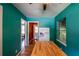 Cozy kitchen with teal walls, butcher block island, and vintage refrigerator at 3020 Washington Rd, East Point, GA 30344