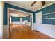 Inviting living room featuring hardwood floors and blue walls with white trim at 3020 Washington Rd, East Point, GA 30344