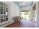 Covered porch features swing and terracotta tile floors for relaxing outdoors at 3020 Washington Rd, East Point, GA 30344