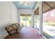 Covered porch features swing and terracotta tile floors for relaxing outdoors at 3020 Washington Rd, East Point, GA 30344
