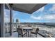 Relax on the balcony with a table and chairs enjoying scenic city views at 3344 Peachtree Ne Rd # 3504, Atlanta, GA 30326