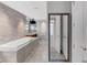 Bright bathroom features a marble soaking tub and elegant fixtures at 3344 Peachtree Ne Rd # 3504, Atlanta, GA 30326