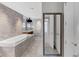 Luxurious bathroom with a soaking tub, marble accents, and a large vanity mirror at 3344 Peachtree Ne Rd # 3504, Atlanta, GA 30326