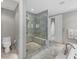 Contemporary bathroom featuring marble walk-in shower with bench seating and glass door at 3344 Peachtree Ne Rd # 3504, Atlanta, GA 30326