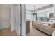 Bright bedroom features a chandelier, neutral decor, and views of the city skyline at 3344 Peachtree Ne Rd # 3504, Atlanta, GA 30326