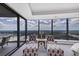 Bedroom featuring two lounge chairs with ottoman and floor to ceiling windows with incredible scenic views at 3344 Peachtree Ne Rd # 3504, Atlanta, GA 30326