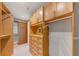 Walk-in closet with custom shelving and drawers providing plenty of storage space at 3344 Peachtree Ne Rd # 3504, Atlanta, GA 30326
