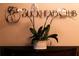 Elegant decor featuring the Buckhead Club sign and decorative orchid arrangement on a wooden table at 3344 Peachtree Ne Rd # 3504, Atlanta, GA 30326