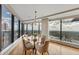 Bright dining room featuring city views, hardwood floors and a stylish chandelier at 3344 Peachtree Ne Rd # 3504, Atlanta, GA 30326