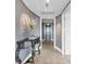Hallway with neutral colors, decorative table and light fixture at 3344 Peachtree Ne Rd # 3504, Atlanta, GA 30326