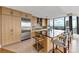 Spacious kitchen featuring a large island, stainless steel refrigerator, and modern appliances at 3344 Peachtree Ne Rd # 3504, Atlanta, GA 30326