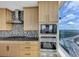 Modern kitchen appliances and cabinetry with an expansive city view at 3344 Peachtree Ne Rd # 3504, Atlanta, GA 30326