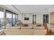 Open living room with large windows showing scenic city views and balcony access at 3344 Peachtree Ne Rd # 3504, Atlanta, GA 30326