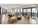 Open living room with large windows showing scenic city views and balcony access at 3344 Peachtree Ne Rd # 3504, Atlanta, GA 30326