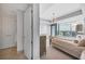 Inviting primary bedroom featuring a walkout to balcony, light-colored carpet, and a city view at 3344 Peachtree Ne Rd # 3504, Atlanta, GA 30326