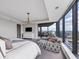 Beautiful primary bedroom featuring a sitting area and floor-to-ceiling windows with cityscape views at 3344 Peachtree Ne Rd # 3504, Atlanta, GA 30326