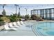 A clear pool with lounge chairs and umbrellas on the deck at 3344 Peachtree Ne Rd # 3504, Atlanta, GA 30326