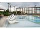 The beautiful pool area has cushioned lounge chairs and trees for shade at 3344 Peachtree Ne Rd # 3504, Atlanta, GA 30326