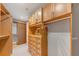 Well-organized walk-in closet with custom wood organizers and plenty of room at 3344 Peachtree Ne Rd # 3504, Atlanta, GA 30326