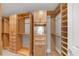 Large walk-in closet featuring custom built-ins with shelving, drawers, and hanging rods at 3344 Peachtree Ne Rd # 3504, Atlanta, GA 30326