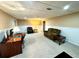Spacious finished basement with carpet, wainscotting, multiple seating areas and computer desk at 753 Summer Ridge Dr, Villa Rica, GA 30180