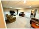 Finished basement includes carpet, wainscotting, multiple seating areas and computer desk at 753 Summer Ridge Dr, Villa Rica, GA 30180
